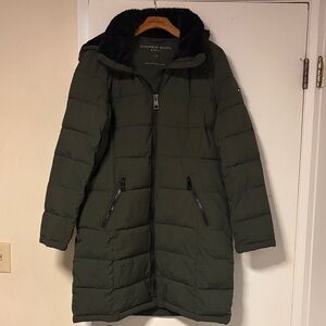 Mid length winter puffy coat. new without tags. measures 24 across chest